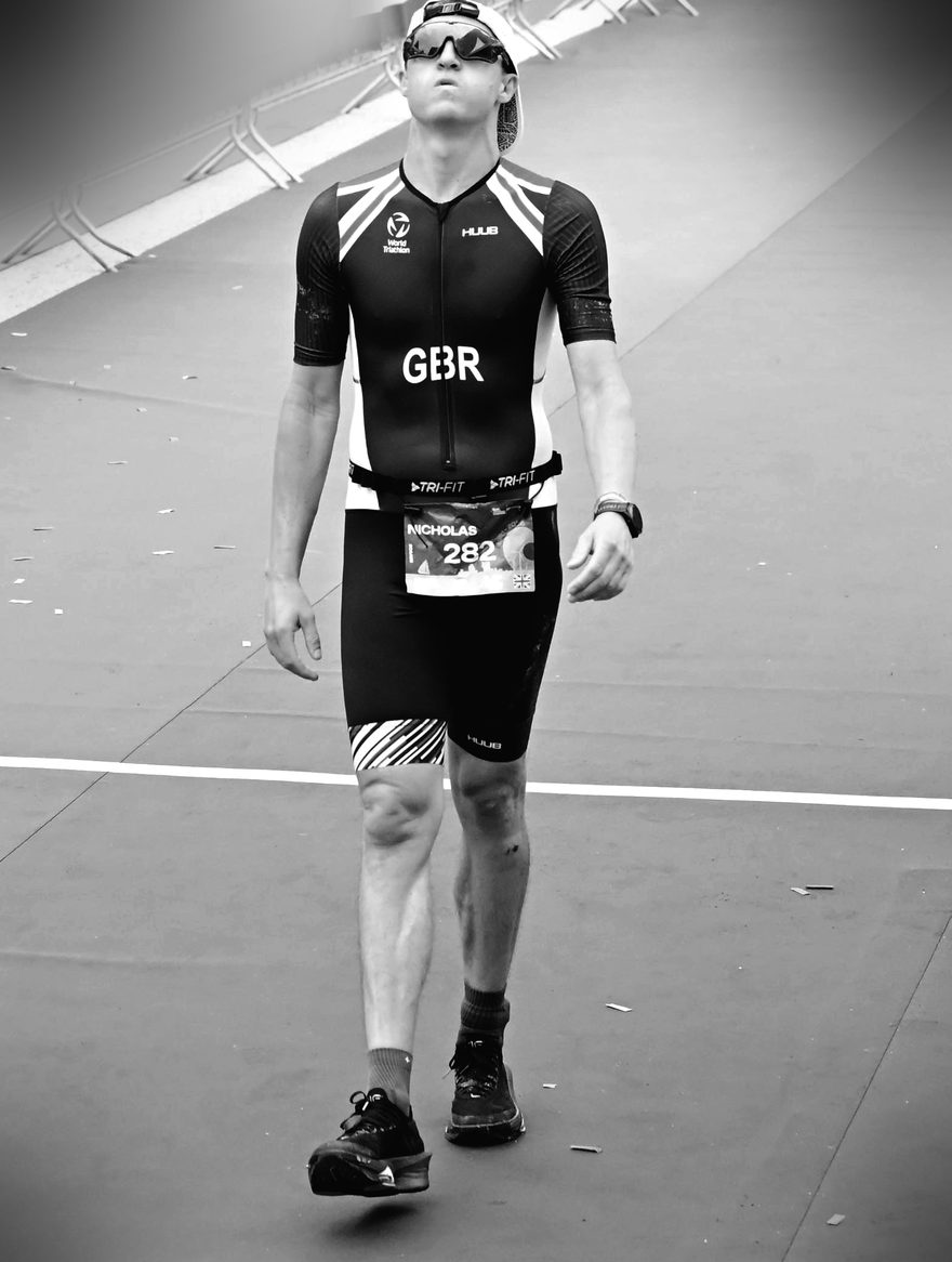 Nick Buckley-Mills in Team GBR kit walking through the finish area at the 2026 European Long Course Championships in Almere, looking up after the race